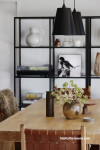 Black fittings contrast to white walls in dining room 