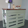 Green bench with stained wood top