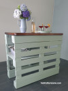 Green bench with stained wood top