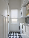 Laundry in white with chequered  floor