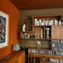 Living area with art, living area with display shelves, living area with art and ceramics