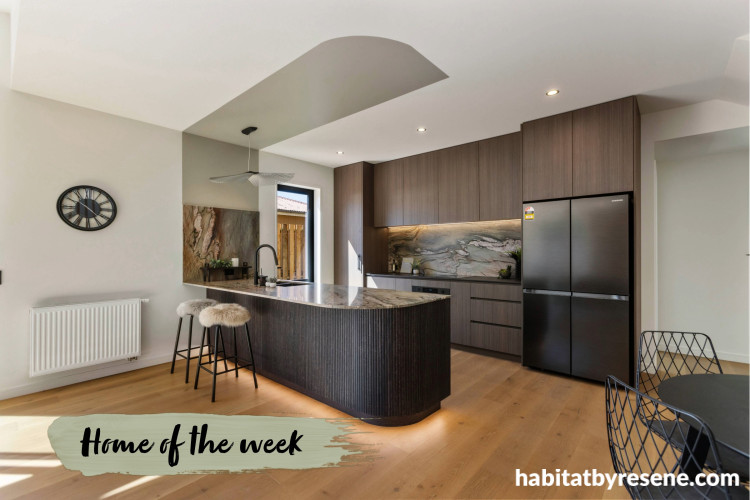 Kitchen featuring an earthy and neutral palette with marble benchtop