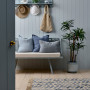Outdoor patio featuring soft blue walls and timber flooring
