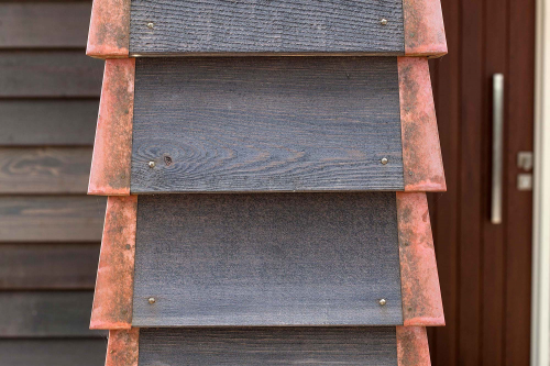 Copper, stained timber