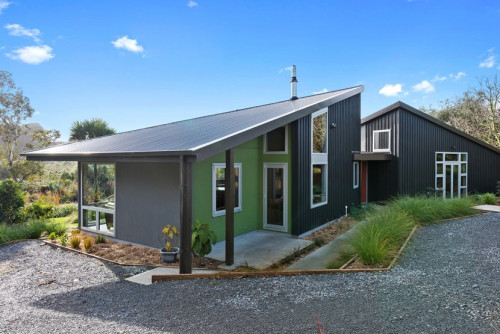house exterior, black house, green feature wall, exterior feature wall