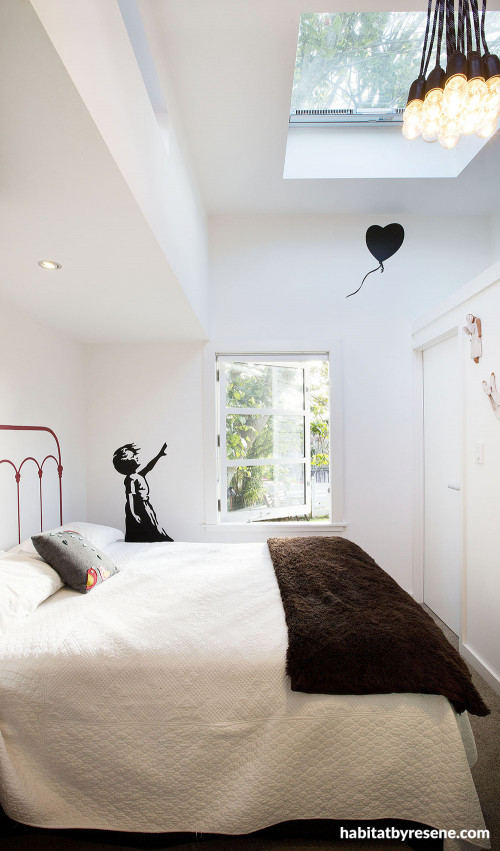 skylight, white bedroom, white paint, small home, white interior, banksy wall art