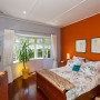master bedroom, orange bedroom, orange feature wall, renovated villa, grey bedroom