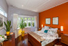 master bedroom, orange bedroom, orange feature wall, renovated villa, grey bedroom