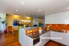 kitchen, dining room, orange splashback, bright kitchen, yellow feature wall, renovated villa 