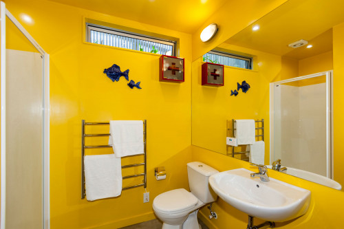 yellow bathroom, painted bathroom, bright bathroom, renovated villa, yellow paint