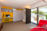 living area, lounge, yellow feature wall, white and yellow, renovated villa, yellow paint 