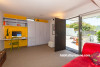 living area, lounge, yellow feature wall, white and yellow, renovated villa, yellow paint 