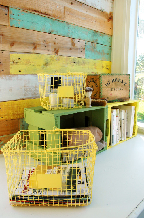 distressed timber wall, rustic loft, feature wall, beer create storage, red and yellow paint