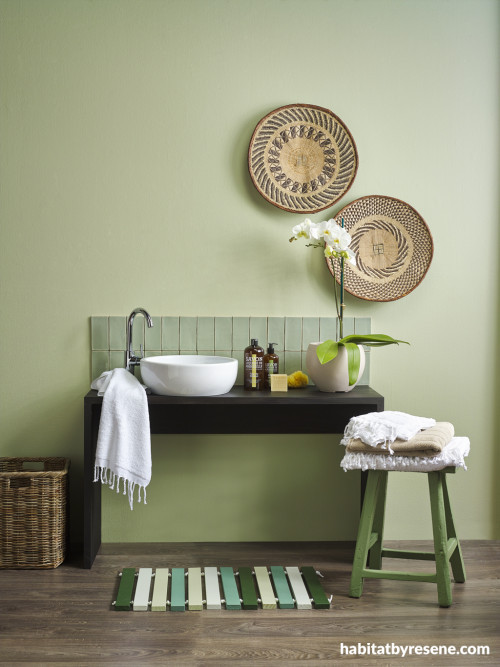 green bathroom, black vanity, green tiles, green paint, bathroom decorating 