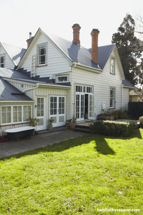 house exterior, green house, green painted weatherboards, neutrals, garden, white house 