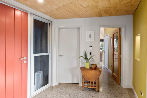 entranceway, red front door, yellow entranceway, plywood ceiling, colourful entranceway