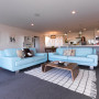 living room, lounge, open-plan, white paint, grey carpet, blue leather sofa 