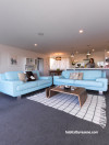 living room, lounge, open-plan, white paint, grey carpet, blue leather sofa 