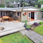 house exterior, painted weatherboards, deck, outdoor living, burnt orange 