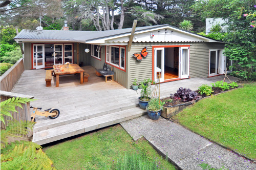 house exterior, painted weatherboards, deck, outdoor living, burnt orange