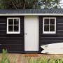 small home, cabin, holiday home, surf, black paint, black and white exterior, sleep out