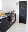 black and white kitchen, white kitchen tiles, black kitchen cabinetry, blackboard paint 