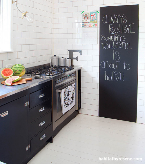 black and white kitchen, white kitchen tiles, black kitchen cabinetry, blackboard paint 