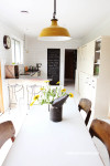 dining room, kitchen, upcycled cabinets, white kitchen tiles, cream paint 