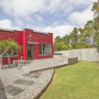 house exterior, red exterior, painted exterior, red paint, art deco home