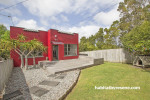 house exterior, red exterior, painted exterior, red paint, art deco home