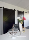 kitchen, black and white kitchen, monochromatic, modern barn doors, black doors