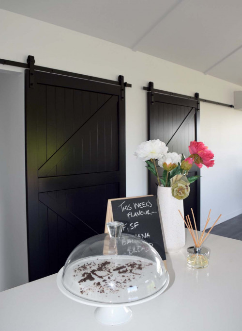 kitchen, black and white kitchen, monochromatic, modern barn doors, black doors