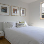 bedroom, white bedroom, eco-friendly home, Kiwiana prints, timber floors, white walls 