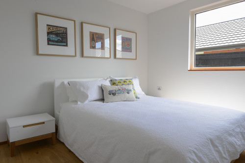 bedroom, white bedroom, eco-friendly home, Kiwiana prints, timber floors, white walls