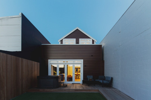 house exteiror, brown house, brown exterior, courtyard, deck, outdoor living