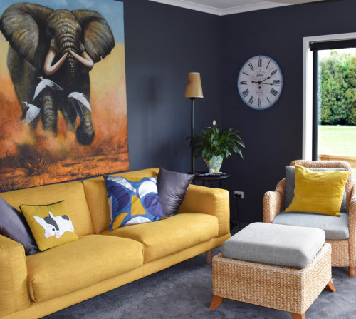 modern French country, black living room, navy lounge, yellow couch, elephant art