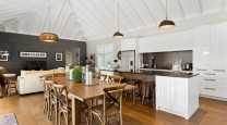 A classically-styled Matarangi bach makes the most of open-plan living photo
