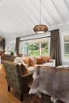 A classically-styled Matarangi bach makes the most of open-plan living