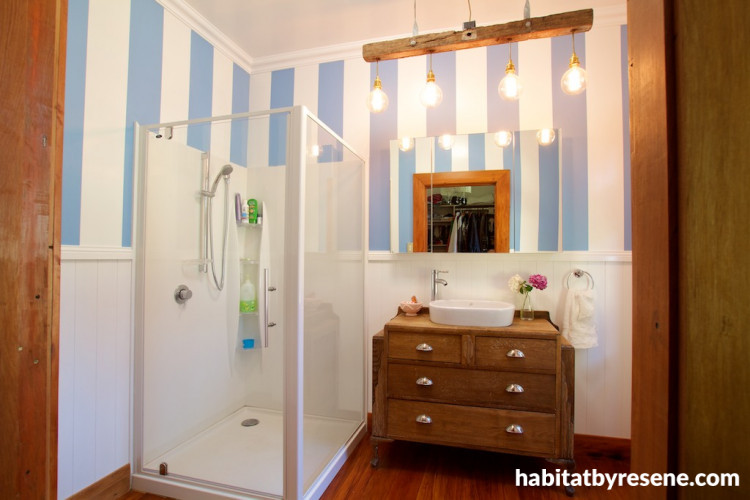 white bathroom, striped bathroom, oak vanity, blue and white paint, vintage bathroom