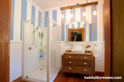 white bathroom, striped bathroom, oak vanity, blue and white paint, vintage bathroom