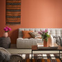 living room, lounge, earthy tones, terracotta feature wall, terracotta lounge, African inspired