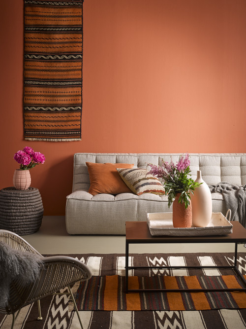 living room, lounge, earthy tones, terracotta feature wall, terracotta lounge, African inspired