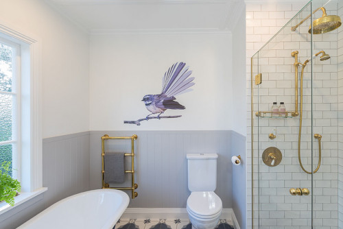 blue bathroom, kids bathroom, tongue and groove, resene, fantail decal, bath tub, brass tapware