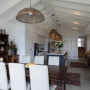 white dining room, open plan living, white kitchen, renovated bungalow, resene half bianca