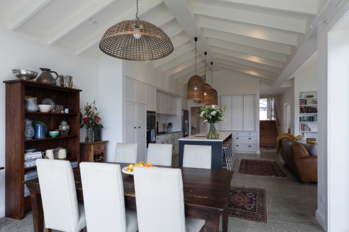 white dining room, open plan living, white kitchen, renovated bungalow, resene half bianca