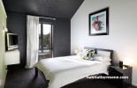 bedroom, black and white bedroom, green feature wall, black bedroom, resene nocturnal 