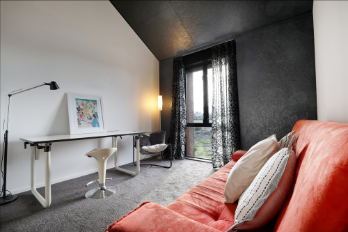 study nook, lounge, black and white study, black and white office, black feature wall, orange