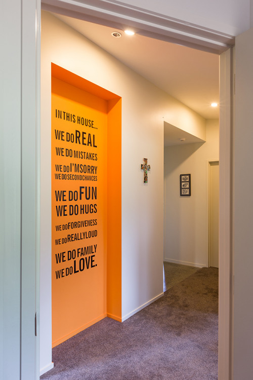 entranceway, hallway, orange paint, writing on walls, interior design, white paint