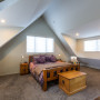 master bedroom, pitched roofline, high ceiling, cream walls, cream paint