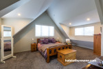 master bedroom, pitched roofline, high ceiling, cream walls, cream paint